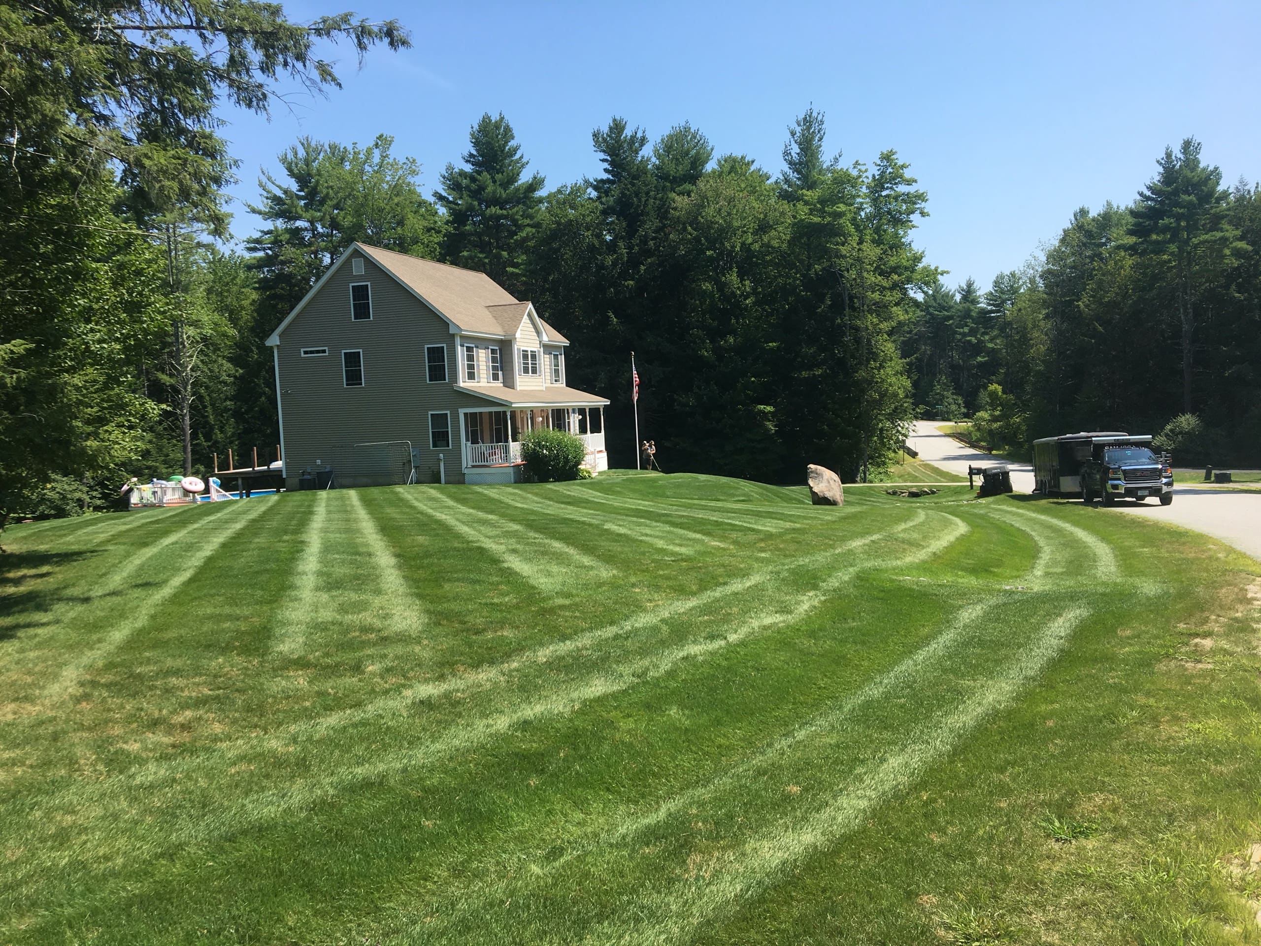 Suburban home with striped lawn mowed